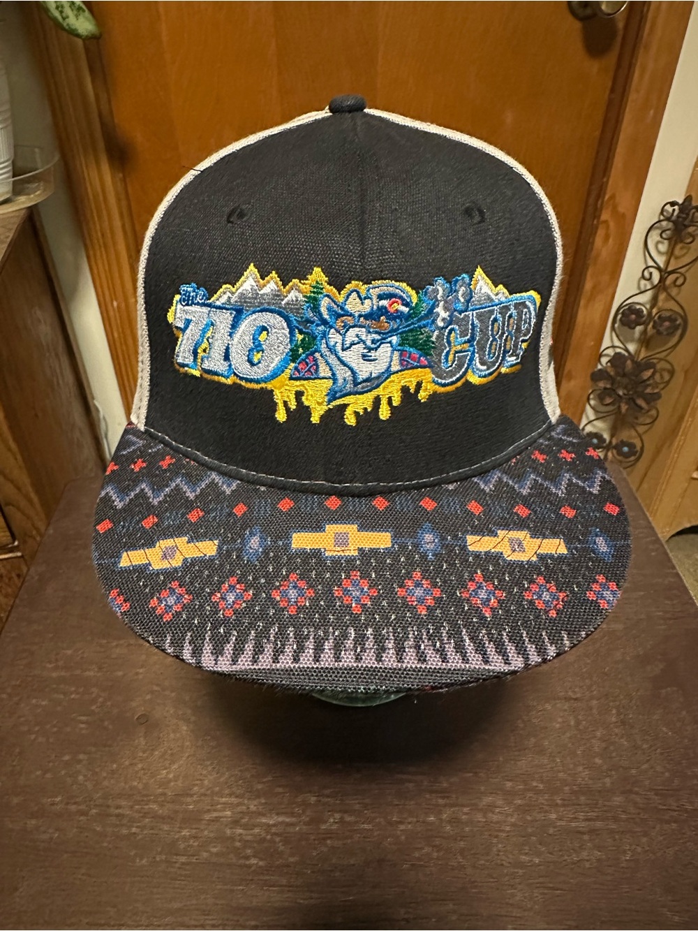 The 710 Cup Black Trucker Hat with Patterned Brim